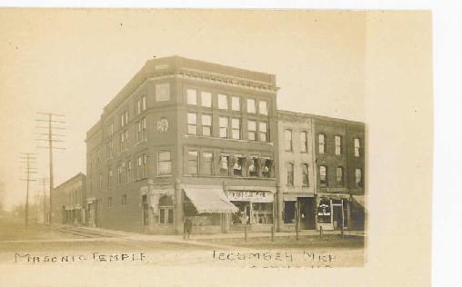 The Masonic Temple building shown around 1900 was built in 1894 on the northeast corner of Evans and Chicago Boulevard by Alfred James and the Tecumseh Masons.  The first floor and the front half of the second floor was financed by James for a grocery, with the remaining portion for the Masons.  A large auditorium for lodge meetings encompassed the story-and-a-half third floor.
